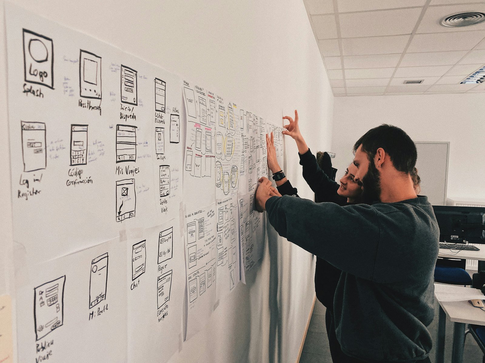 Veinbit mapping screen flows and architecture on the wall before writing code